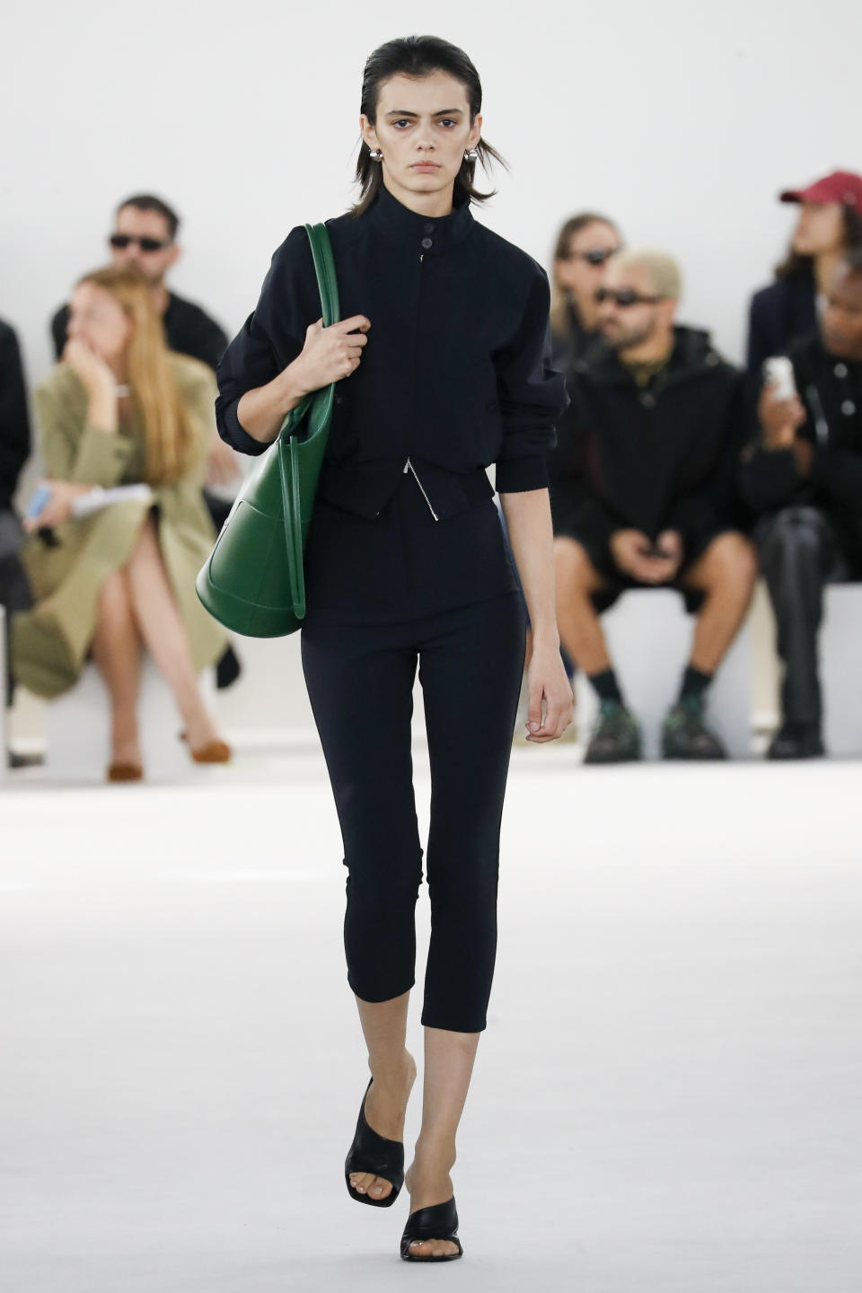 a ferragamo model wears black capri pants in a story about bella hadid wearing capri pants