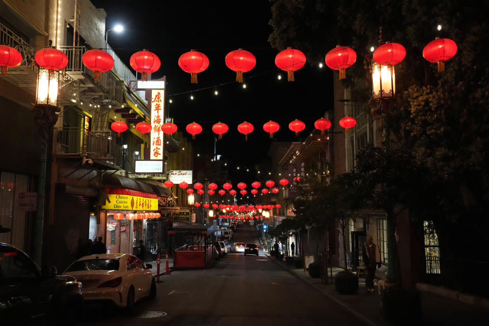 Lanterns illuminate Chinatown along Grant Avenue in San Francisco, Wednesday, Nov. 8, 2023. San Francisco's Chinatown was hit hard by the pandemic as tourism dried up. Leaders in the community hope to use next week's Asia-Pacific Economic Cooperation leaders' summit to declare that Chinatown is back and ready for business. (AP Photo/Eric Risberg)