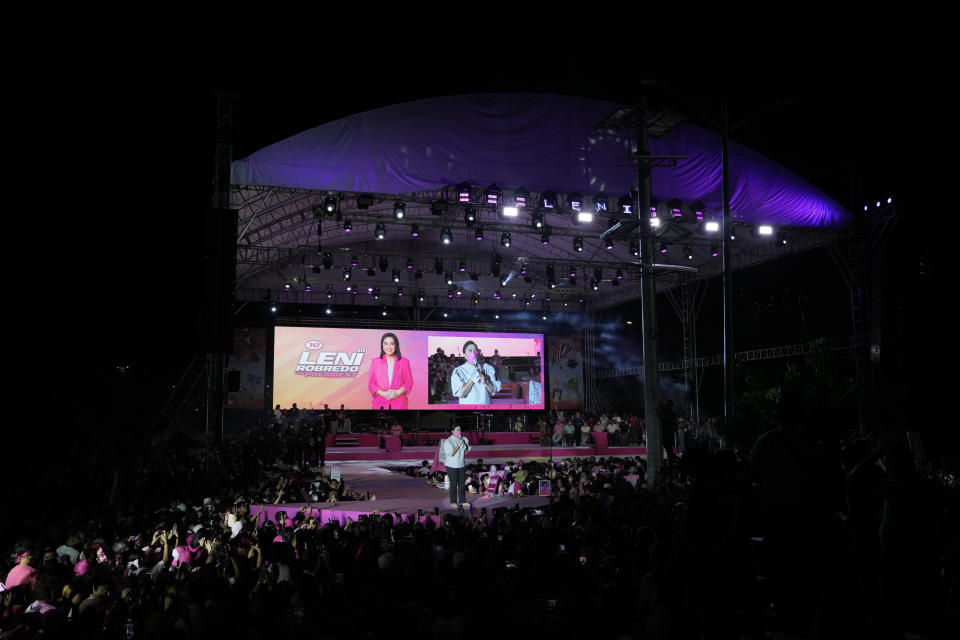 Presidential candidate, current Vice President Leni Robredo, talks to supporters during a campaign in Pasay City, Philippines on Sunday, April 24, 2022. Followers from diverse backgrounds, families with their grandparents and children, activists, doctors, Catholic church people, TV and movie stars, farmers, students, have jammed Robredo's fiesta-like campaign rallies in the tens of thousands in recent weeks. She called the emerging movement a "pink revolution" in October because many of her volunteers were clad in that color of advocacy. (AP Photo/Aaron Favila)