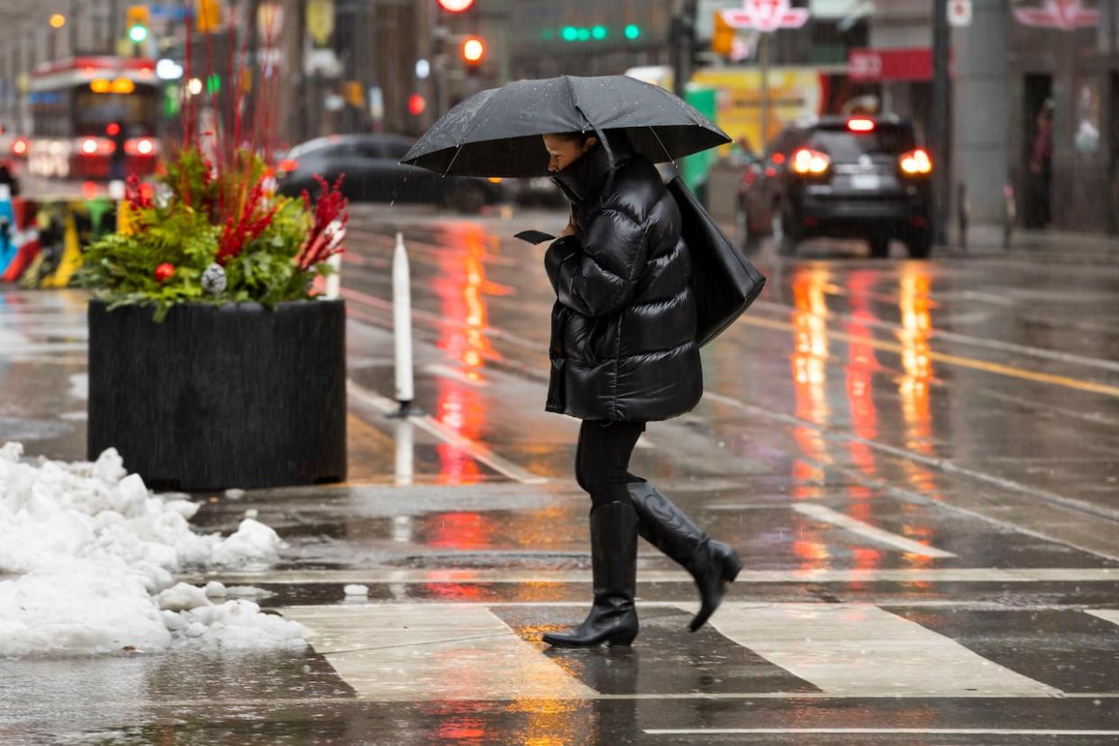 Environment Canada issued a new special weather statement for Toronto on Wednesday, saying the city should expect an additional 10 to 15 millimetres of rain on Wednesday evening. The rain could mix with or turn into wet snow overnight, particularly in areas away from Lake Ontario,  (Michael Wilson/CBC - image credit)