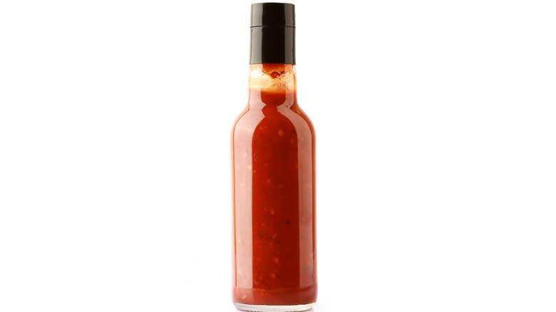 Hot sauce bottle on white