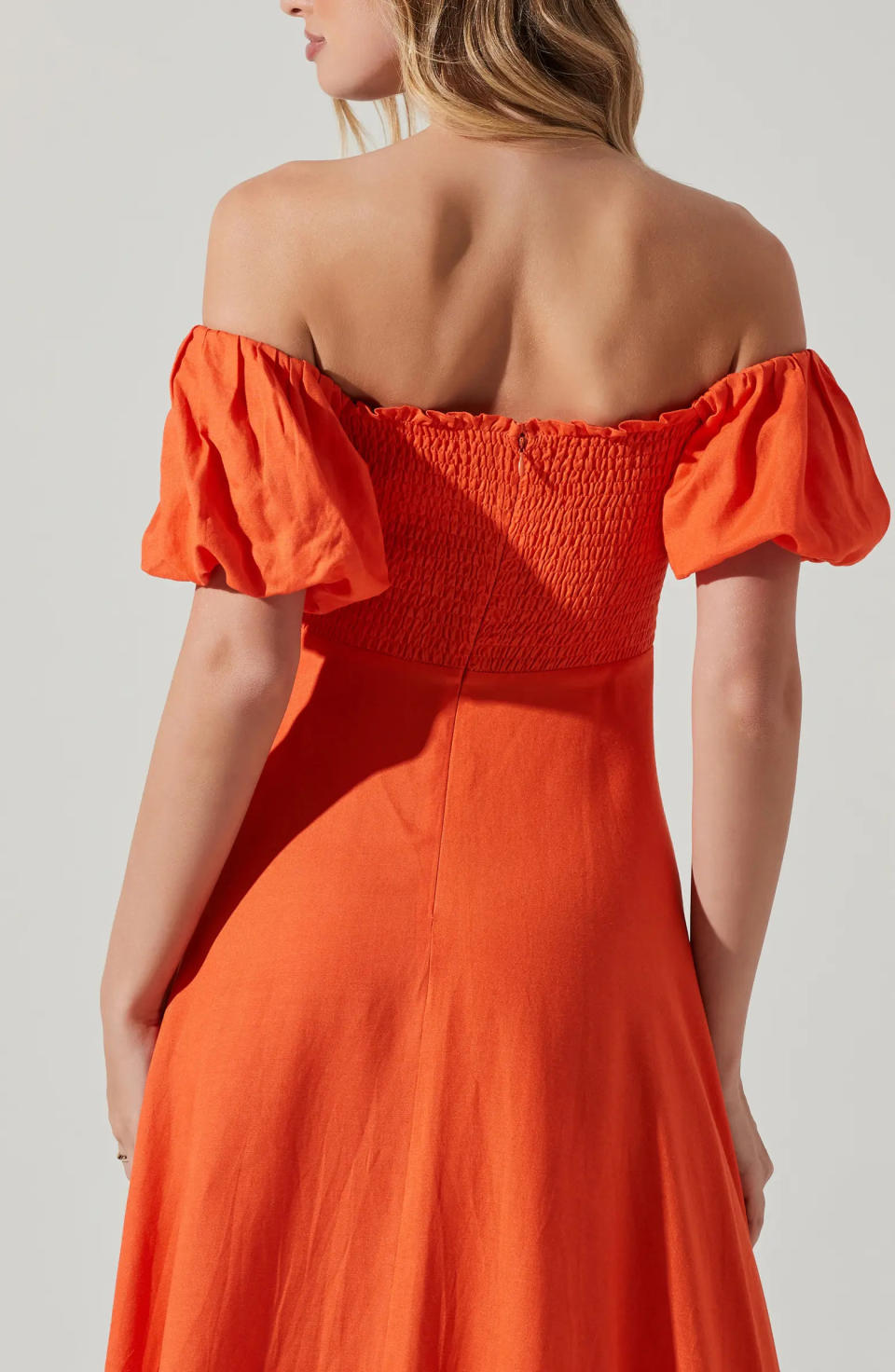Also available in this spicy orange hue, you can brighten any party wearing this ASTR the Label dress.