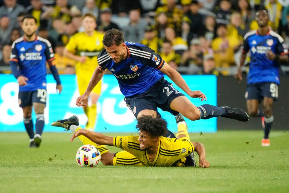 May 11, 2024; Columbus, OH, USA; Columbus Crew forward Jacen Russell-Rowe (19) is fouled by FC Cincinnati defender Matt Miazga (21) during the first half of the MLS soccer game at Lower.com Field.