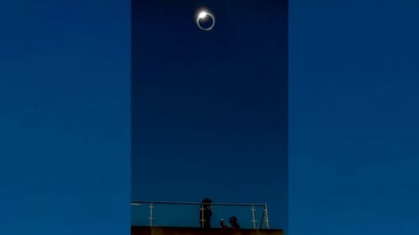  A marriage proposal beneath totality of a solar eclipse. 