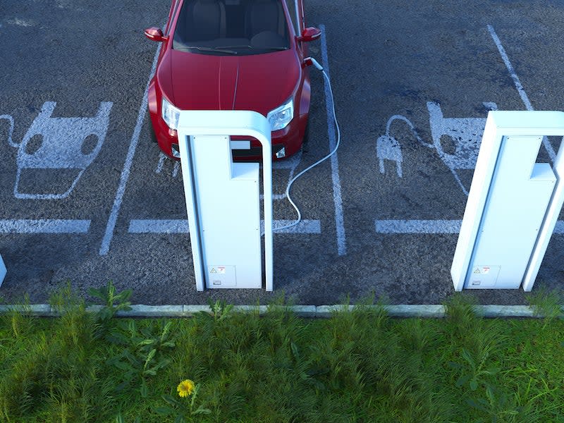 electric car at a charging station in a parking lot