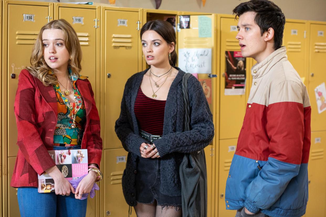 Sex Education's Aimee (Aimee Lou Wood), Maeve (Emma Mackey) and Otis (Asa Butterfield) in the corridors of Moordale High: Netflix