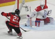 Czechia goaltender Klara Peslarova (29) stops a shot by Canada's Ashton Bell (21) during the third period of a hockey match at the IIHF Women's World Championships in Utica, N.Y., Sunday, April 7, 2024. (Christinne Muschi/The Canadian Press via AP)