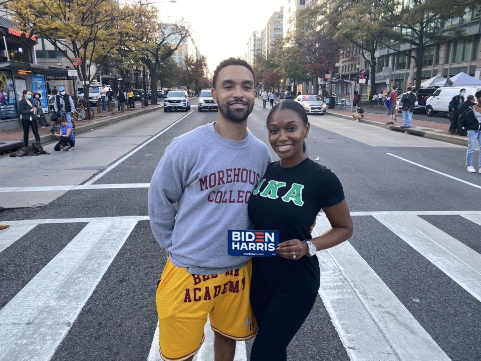 Theo Guidry and his wife, Gina, came to Black Lives Matter Plaza wearing a Morehouse College sweater and Alpha Kappa Alpha shirt. (Photo: Philip Lewis/HuffPost)