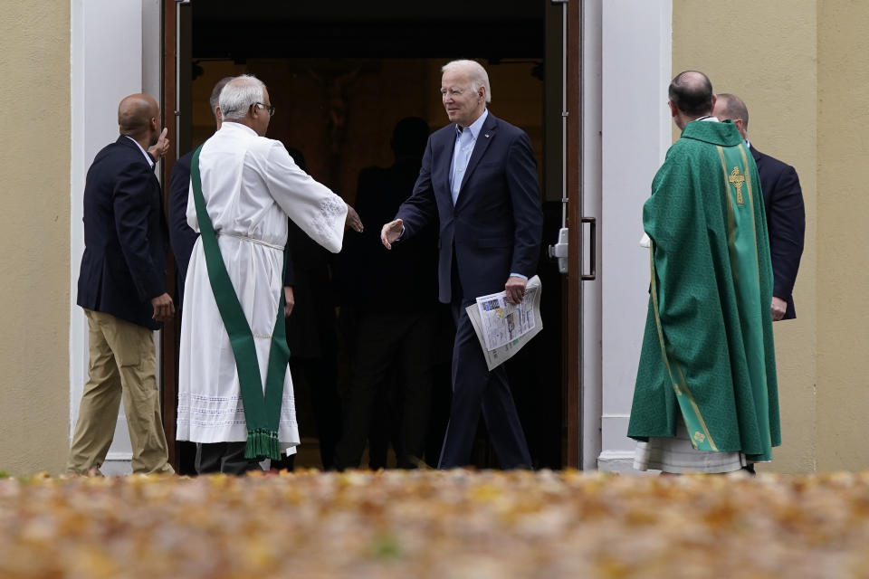 President Joe Biden speaks with priests as he departs after attending Mass at St. Joseph on the Brandywine Catholic Church, Sunday, Nov. 6, 2022, in Wilmington, Del. (AP Photo/Patrick Semansky)