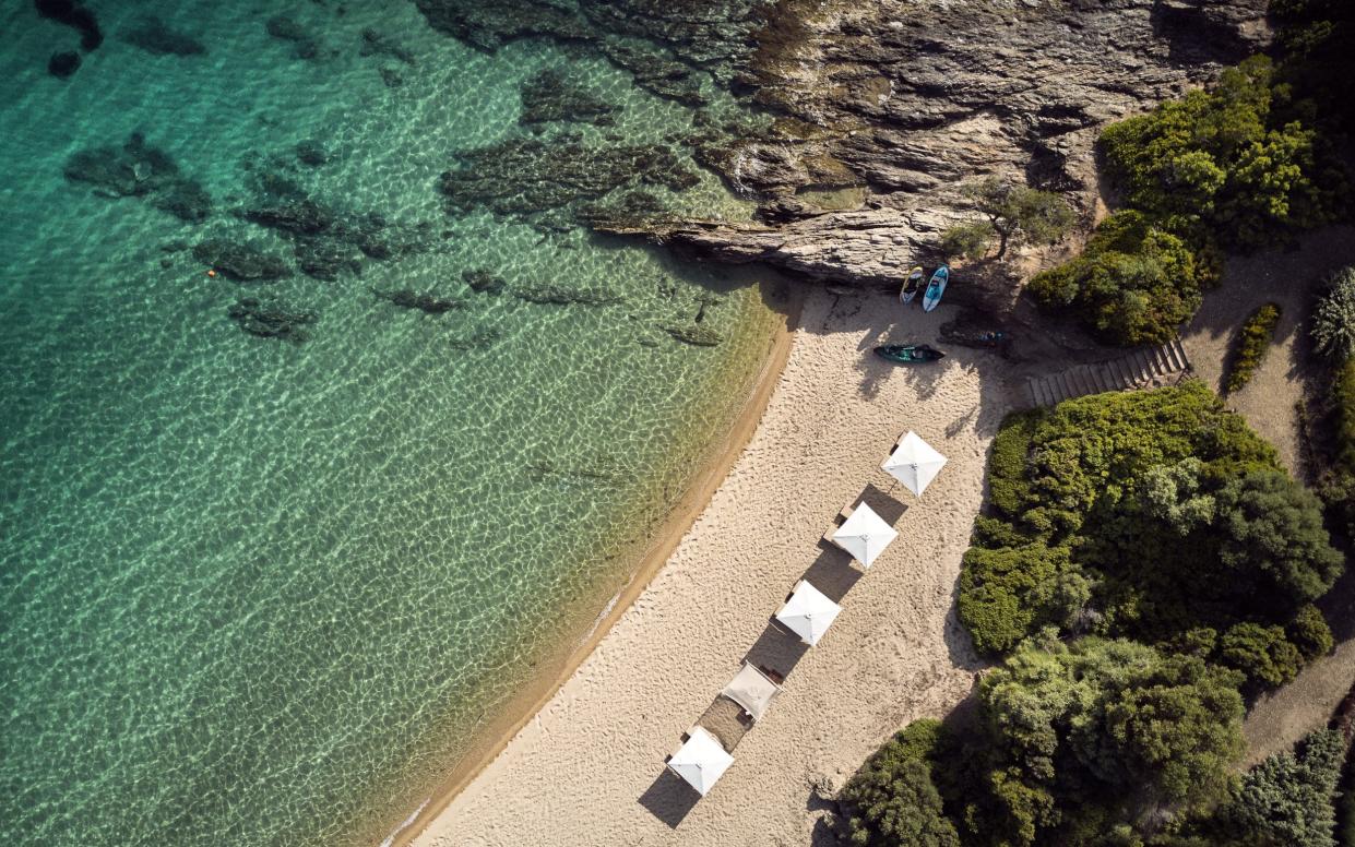 Aerial view of a beach and crystal clear water