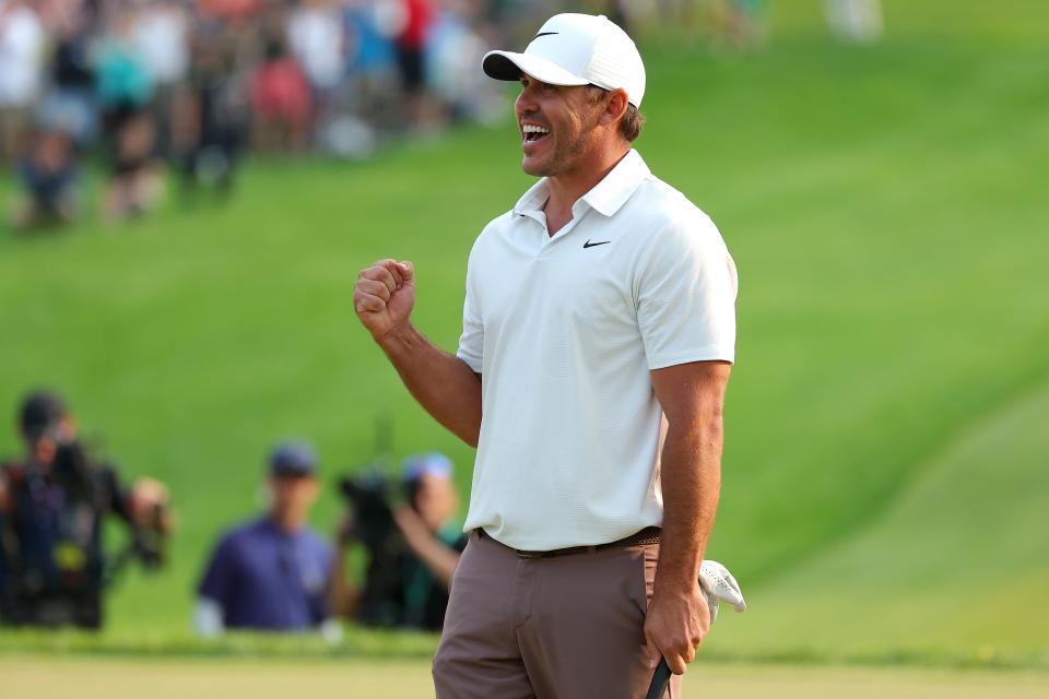 Brooks Koepka celebrates on the 18th green after winning the 2023 PGA Championship at Oak Hill Country Club in Rochester, New York on May 21, 2023.