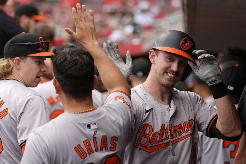 Baltimore Orioles' Jordan Westburg, right, celebrates hitting a two-run homer in the dugout in the first inning of a baseball game against the Cincinnati Reds on Sunday, May 5, 2024, in Cincinnati. (AP Photo/Carolyn Kaster)