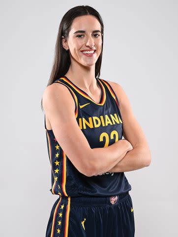 <p>Matt Kryger/NBAE via Getty Images</p> Caitlin Clark #22 of the Indiana Fever poses for a portrait at Gainbridge Fieldhouse during her introductory press conference on April 17, 2024