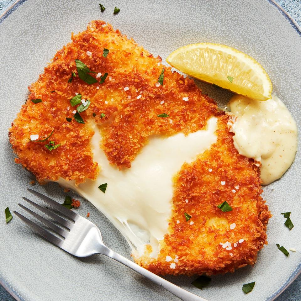 mozzarella schnitzel with mustard cream sauce and lemon