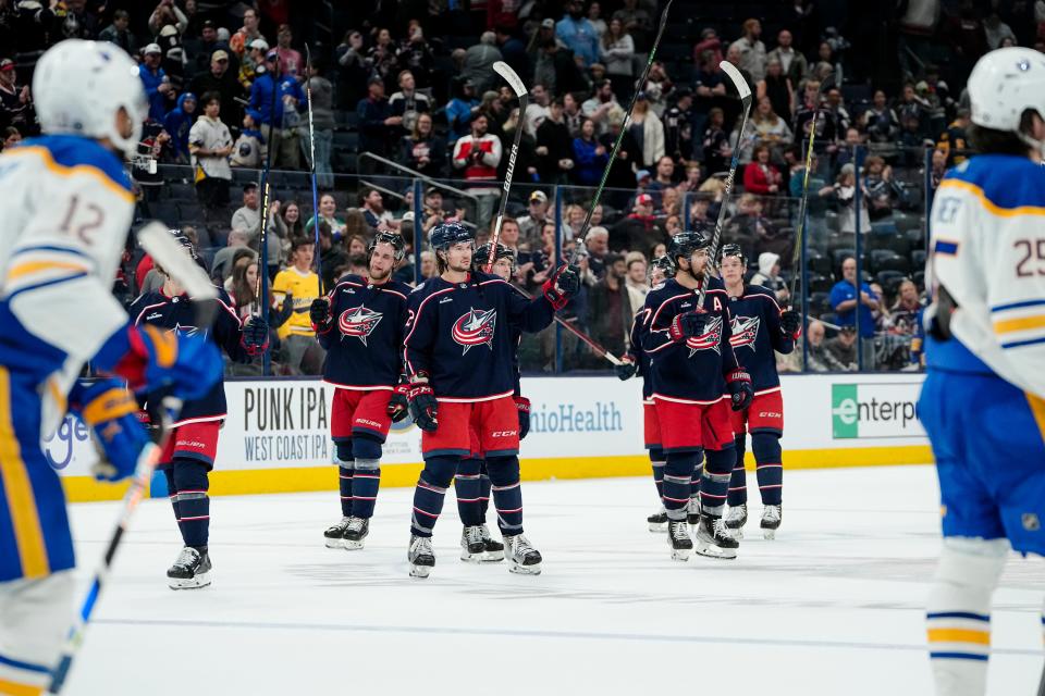 Columbus Blue Jackets players salute the fans following the NHL hockey game against the Buffalo Sabres at Nationwide Arena in Columbus on April 14, 2023. The Blue Jackets lost 5-2.