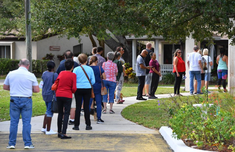 Voters wait in line to vote Tuesday afternoon, Nov. 8, 2022 the polling place at Beneva Christian Church in Sarasota, Florida.  Shortly after lunch, the wait to vote was about 20 minutes. 