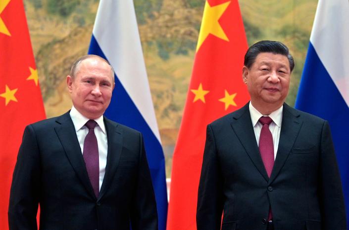 Chinese President Xi Jinping, right, and Russian President Vladimir Putin pose for a photo prior to their talks in Beijing, China, Feb. 4, 2022.