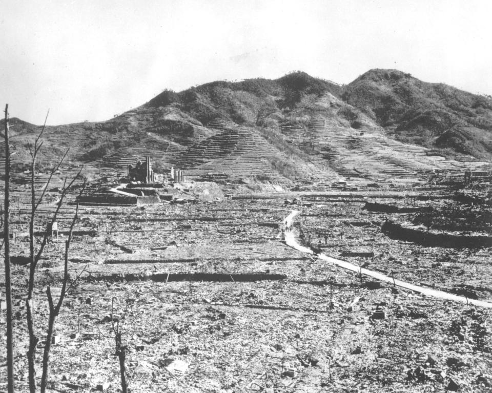FILE - In this 1945, file photo, destroyed beyond recognition, the Roman Catholic Church of Urakami stands out over the burn-razed cityscape of Nagasaki, Japan, after the second atomic bomb ever used in warfare was dropped by the U.S. over the Japanese industrial center. The city of Nagasaki in southern Japan marks the 75th anniversary of the U.S. atomic bombing of Aug. 9, 1945. Japan surrendered on Aug. 15, ending World War II and its nearly a half-century aggression toward Asian neighbors.Dwindling survivors, whose average age exceeds 83, increasingly worry about passing their lessons on to younger generations. (AP Photo, File)