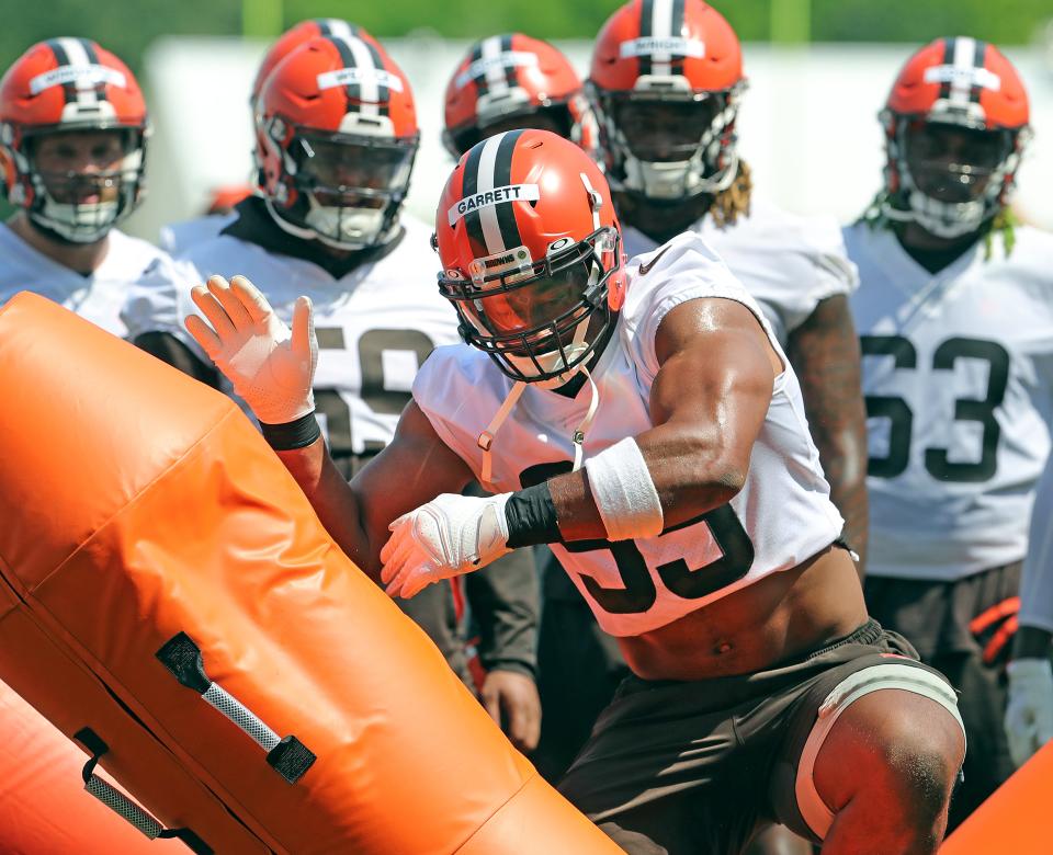 Browns defensive end Myles Garrett punishes a tackling dummy during OTA drills on Wednesday, June 1, 2022 in Berea.