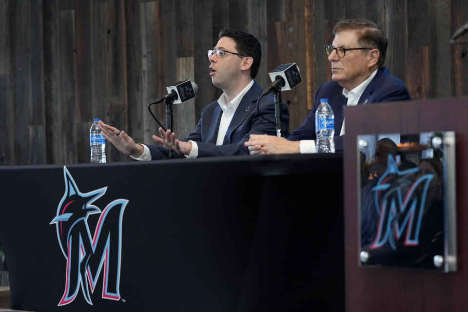 Peter Bendix, Miami Marlins new president of baseball operations, gestures while speaking during his introductory news conference Monday, Nov. 13, 2023, in Miami. At right is Marlins owner Bruce Sherman. (AP Photo/Lynne Sladky)