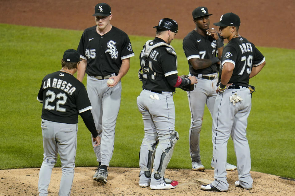 Chicago White Sox manager Tony La Russa (22) takes the ball from relief pitcher Garrett Crochet (45) during the seventh inning of a baseball game against the Pittsburgh Pirates in Pittsburgh, Tuesday, June 22, 2021. (AP Photo/Gene J. Puskar)