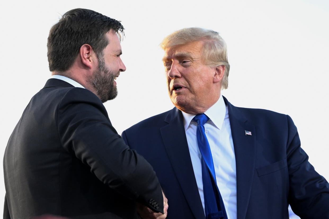 U.S. Senate Republican candidate J.D. Vance, who was endorsed by former U.S. President Donald Trump for the upcoming primary elections, shakes hands with Trump during an event hosted by him, at the county fairgrounds in Delaware, Ohio on April 23, 2022. (Gaelen Morse/Reuters)