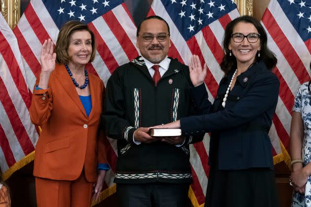 Speaker of the House Nancy Pelosi of California administers the oath of office to Rep. Mary Peltola (D-Alaska), accompanied by her husband, Eugene “Buzzy” Peltola Jr., in September 2022.