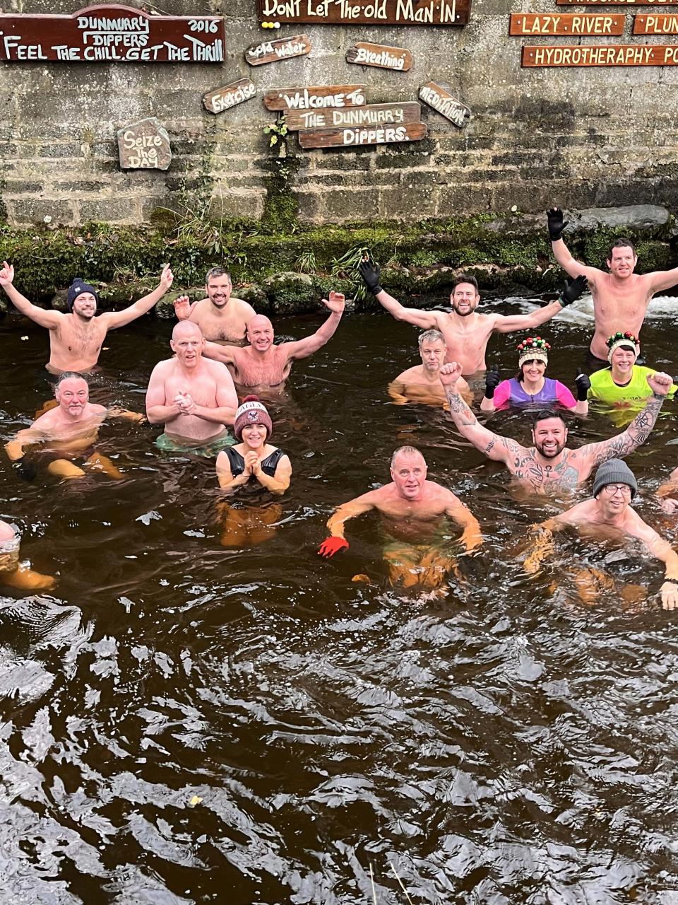 The swimmers in the icy cold Colin River (Dunmurry Dippers/PA)