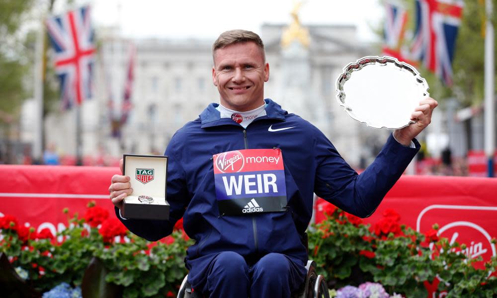 Great Britain’s David Weir celebrates winning the men’s wheelchair race.