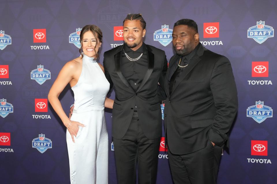 Washington Huskies wide receiver Rome Odunze stands on the red carpet ahead of the 2024 NFL Draft at Detroit’s Fox Theatre.