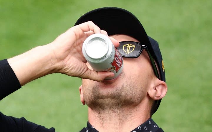 Mackenzie Hughes of the International Team downs a beer on the first tee during Thursday's four-ball matches on day one of the 2024 Presidents Cup at The Royal Montreal Golf Club - Mackenzie Hughes' beer-chugging exploits add much-needed fizz to Presidents Cup's opening day