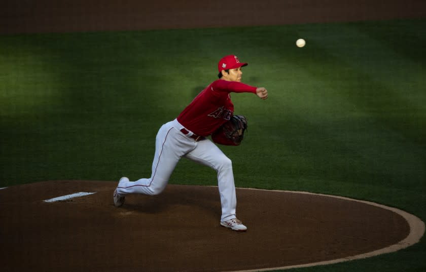 ANAHEIM, CA - APRIL 20, 2021: Los Angeles Angels starting pitcher Shohei Ohtani (17) walked 3 batters in the first inning, but managed to get out of the jam against the Texas Rangers at Angel Stadium on April 20, 2021 in Santa Ana California.(Gina Ferazzi / Los Angeles Times)