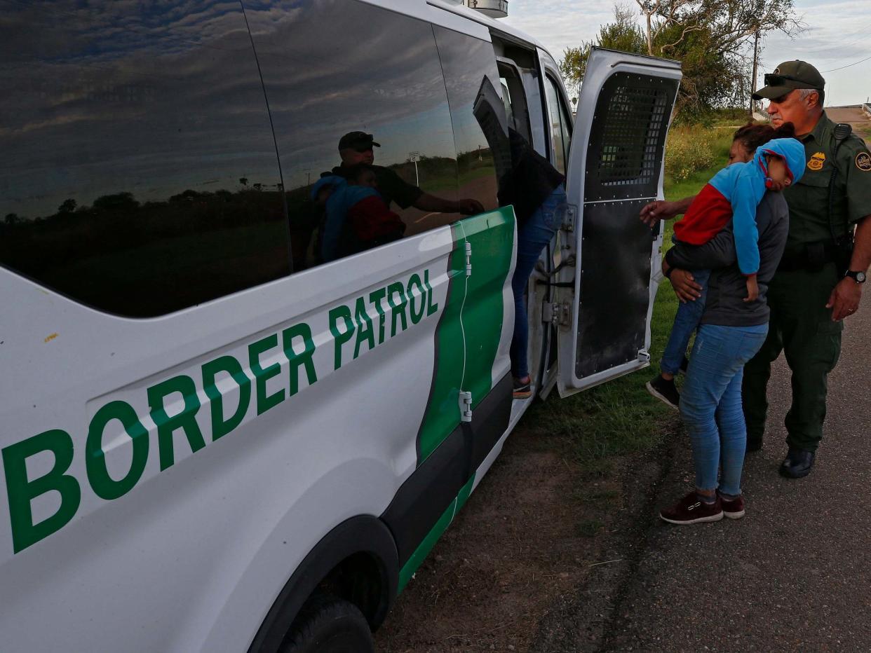 US Border Patrol agents apprehend families suspected of crossing the Rio Grande River to enter the United States illegally on 11 September 2019: Larry W Smith/EPA