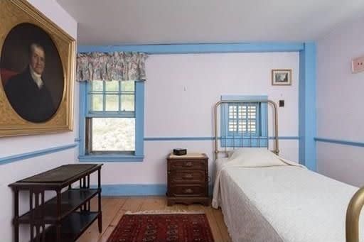 The upstairs bedroom is part of the original 1650 house.