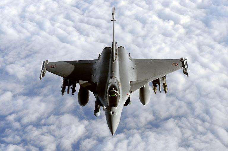 During a refuelling operation above the Mediterranean sea, a French Rafale fighter jet approaches an airborne Boeing C-135 refuelling tanker aircraft (not pictured), on March 30, 2011