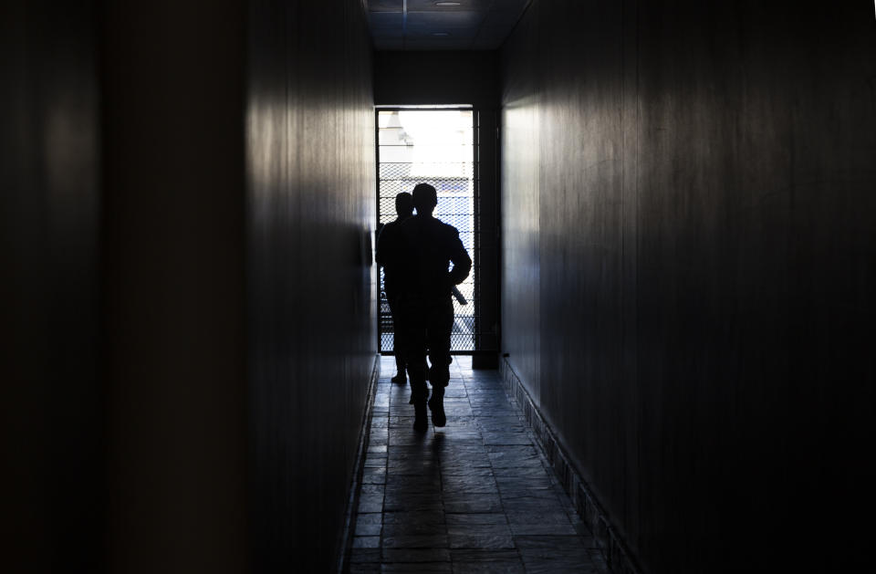 A dark passage during a power outage in a Johannesburg shopping centre, Thursday, June 30, 2022. South Africans are struggling in the dark to cope with increased power cuts that have hit households and businesses across the country. The rolling power cuts have been experienced for years but this week the country’s state-owned power utility Eskom extended them so that some residents and businesses have gone without power for more than 9 hours a day. (AP Photo/Denis Farrell)