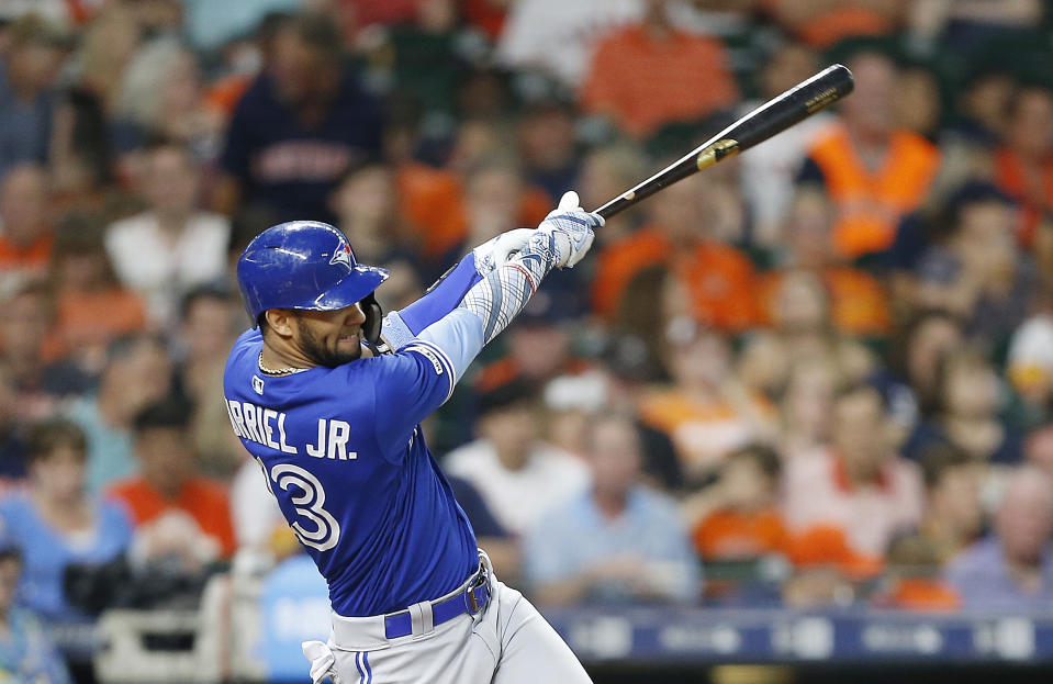 HOUSTON, TEXAS - JUNE 16: Lourdes Gurriel Jr. #13 of the Toronto Blue Jays hits a two run home run in the fifth inning against the Houston Astros at Minute Maid Park on June 16, 2019 in Houston, Texas. (Photo by Bob Levey/Getty Images)