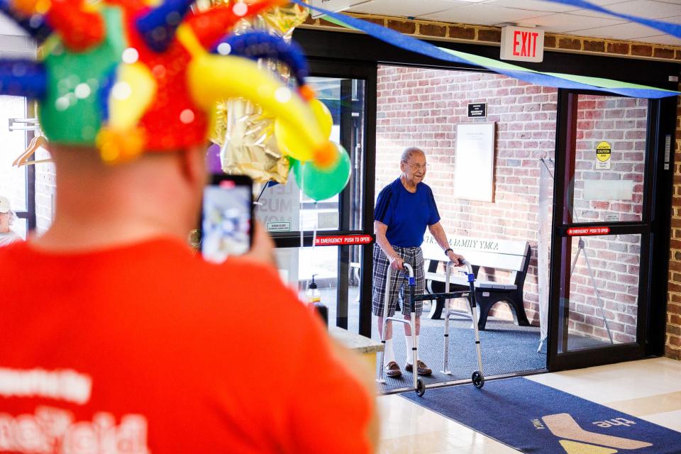 Staff members and friends surprise Les Savino of Hanover during a surprise party the day before Savino's 100th birthday at the Hanover YMCA, Friday, Aug. 26, 2022, in Hanover Borough. Savino has come to the YMCA every weekday morning at 7:30 a.m. to work out for three hours for 39 years.