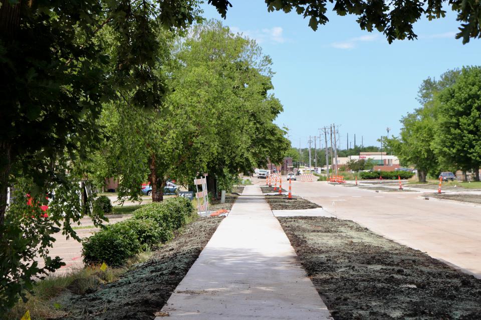 Sidewalks were resurfaced and expanded along 5th Street between 20th Avenue and 18th Avenue, seen on Wednesday, June 26, 2024 in Coralville, Iowa. The road is set to reopen on June 27 as the initial phases of the 5th Street Improvement project completes.