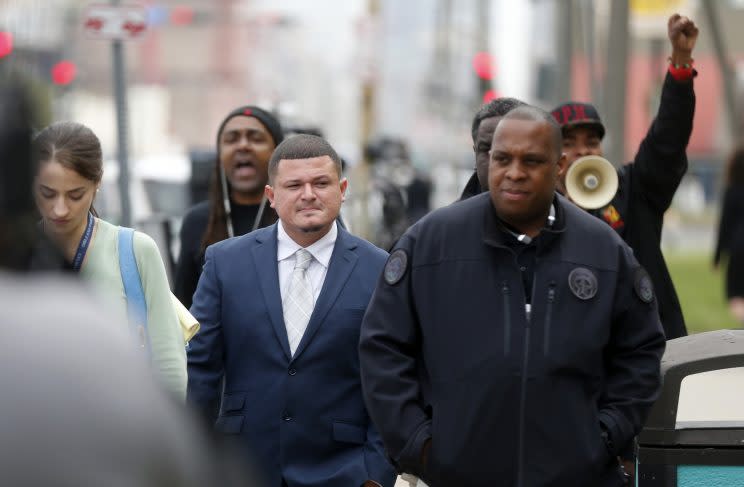 Richard Hernandez (middle) is followed and heckled by supporters of Cardell Hayes, after testifying in the murder trial of former Saint Will Smith. (AP) 