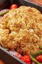 <p>A whole roasted cauliflower makes for a fantastic vegetarian main dish. This one is roasted around extra veggies and has a slightly sweet balsamic glaze over it. It's easy to throw together and will leave you feeling full, not heavy.</p><p>Get the <a href="https://www.delish.com/uk/cooking/recipes/a33948230/balsamic-glazed-roasted-cauliflower-recipe/" rel="nofollow noopener" target="_blank" data-ylk="slk:Balsamic Glazed Roasted Cauliflower;elm:context_link;itc:0;sec:content-canvas" class="link ">Balsamic Glazed Roasted Cauliflower</a> recipe.</p>