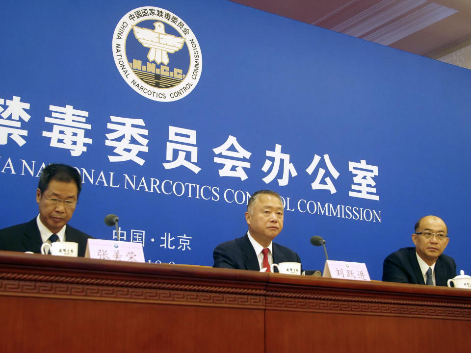 Liu Yuejin, center, the vice commissioner of China's National Narcotics Control Commission, speaks during a press conference in Beijing, Tuesday, Sept. 3, 2019. China said Tuesday it's not the source of the fentanyl that's killing Americans, contrary to President Donald Trump's recent tweets blaming China for the drug deaths. (AP Photo/Sam McNeil)