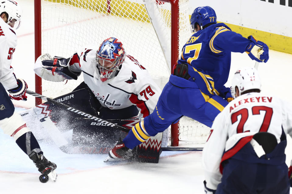 Buffalo Sabres right wing JJ Peterka (77) is stopped by Washington Capitals goaltender Charlie Lindgren (79) during the third period of an NHL hockey game Thursday, April 11, 2024, in Buffalo, N.Y. (AP Photo/Jeffrey T. Barnes)