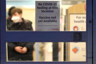 FILE - In this Jan. 16, 2021, file photo, a sign saying that a COVID-19 vaccine is not yet available hangs at Walgreens in Glenview, Ill. Smaller-than-expected vaccine deliveries from the federal government have caused frustration and confusion and limited states' ability to attack the outbreak that has killed over 400,000 Americans.(AP Photo/Nam Y. Huh, File)