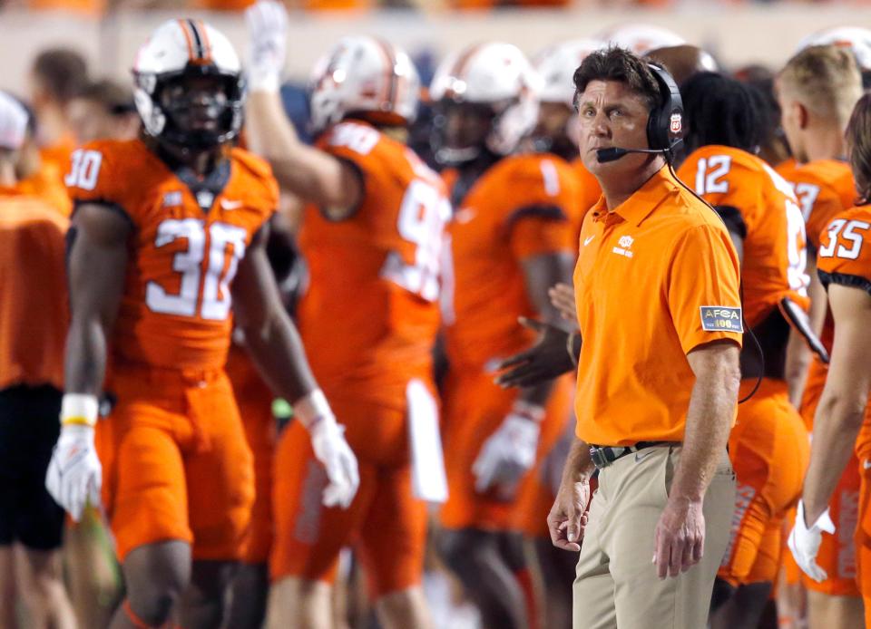 Mike Gundy watches from the sidelines during a 58-44 win against Central Michigan on Thursday in Stillwater. It was Gundy's 150th career win as OSU head coach.