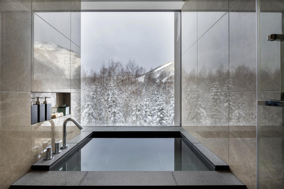 An onsen-style soaking tub at Higashiyama Niseko Village, a Ritz-Carlton Reserve