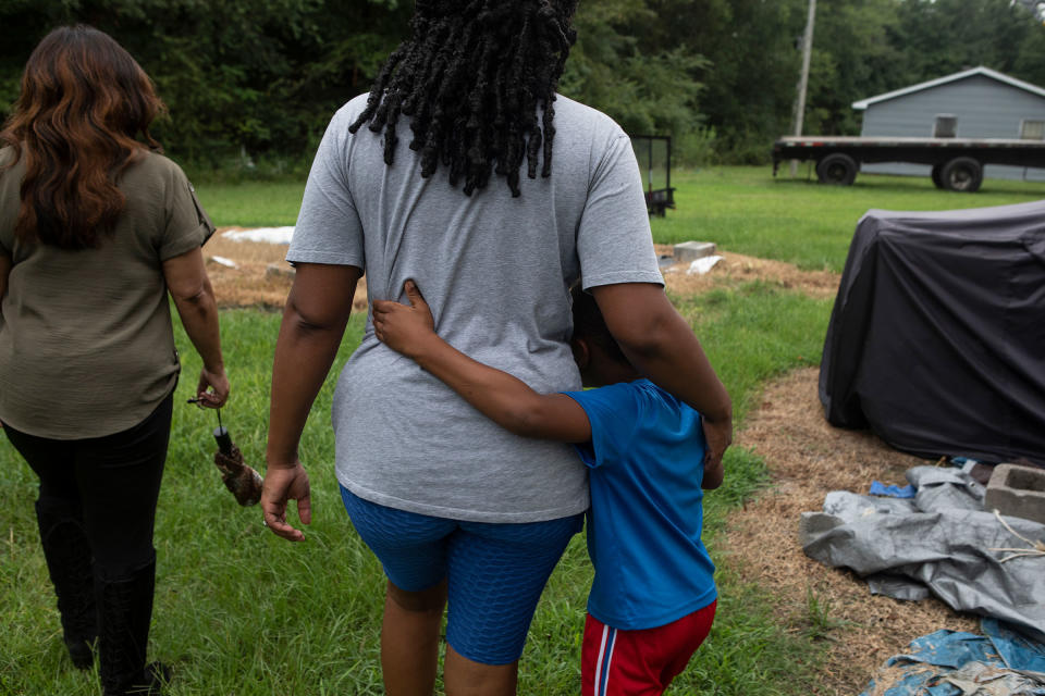 Residents of Lowndes County, who are struggling with sewage problems, walk alongside Catherine Flowers.<span class="copyright">Charity Rachelle for TIME</span>