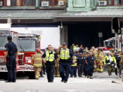 <p>Hoboken police officers look over the scene of a train crash where a New Jersey Transit train derailed and crashed through the station, injuring more than 100 people, in Hoboken, New Jersey, U.S. September 29, 2016. REUTERS/Shannon Stapleton </p>