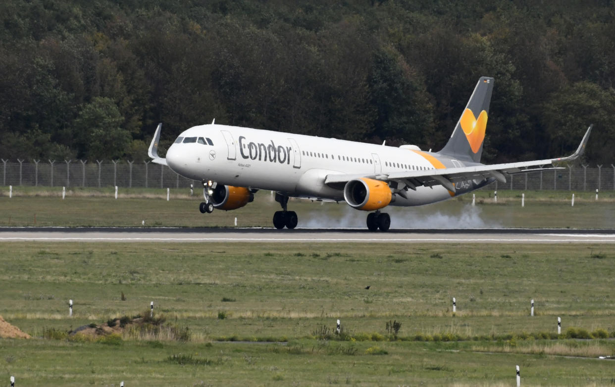 An airplane of Condor, the German airline subsidiary of the British travel giant Thomas Cook, is seen during landing on September 24, 2019 at the airport in Duesseldorf, western Germany. - As British tour operator Thomas Cook declared bankruptcy, some 600,000 tourists from around Europe had their holidays disrupted. Thomas Cook's subsidiary Condor has said it will continue flying and applied for an emergency "bridging loan" from Berlin. (Photo by Ina FASSBENDER / AFP)        (Photo credit should read INA FASSBENDER/AFP/Getty Images)