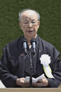 Takashi Miyata delivers a speech as a representative of A-bomb survivors during a ceremony to mark the 77th anniversary of the U.S. atomic bombing at Peace Park in Nagasaki, southern Japan, Tuesday, Aug. 9, 2022. (Kyodo News via AP)